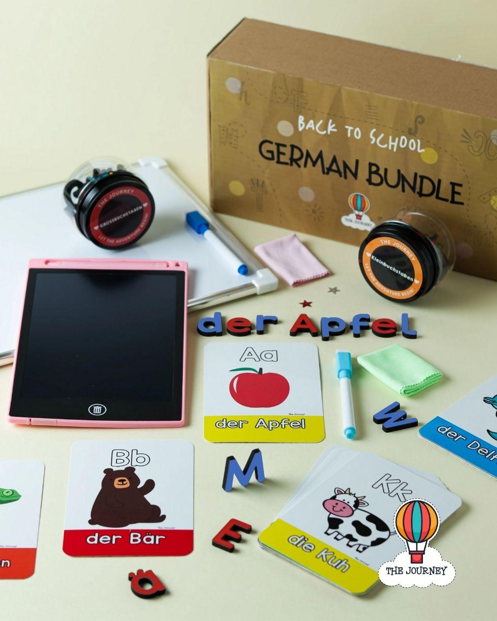 Educational materials including flashcards and a writing pad with 'Back to School German Bundle' packaging.