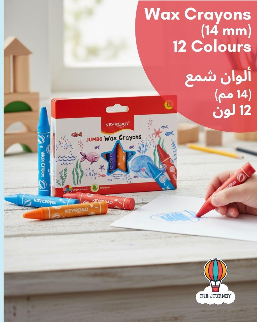 Keyroad Jumbo Wax Crayons set with 12 colors on a table, with a child's hand using a red crayon.