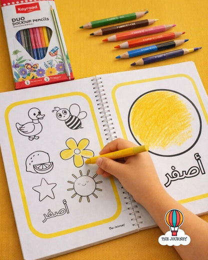 Coloring book with yellow pencils on a yellow background, featuring the brand 'The Journey'.
